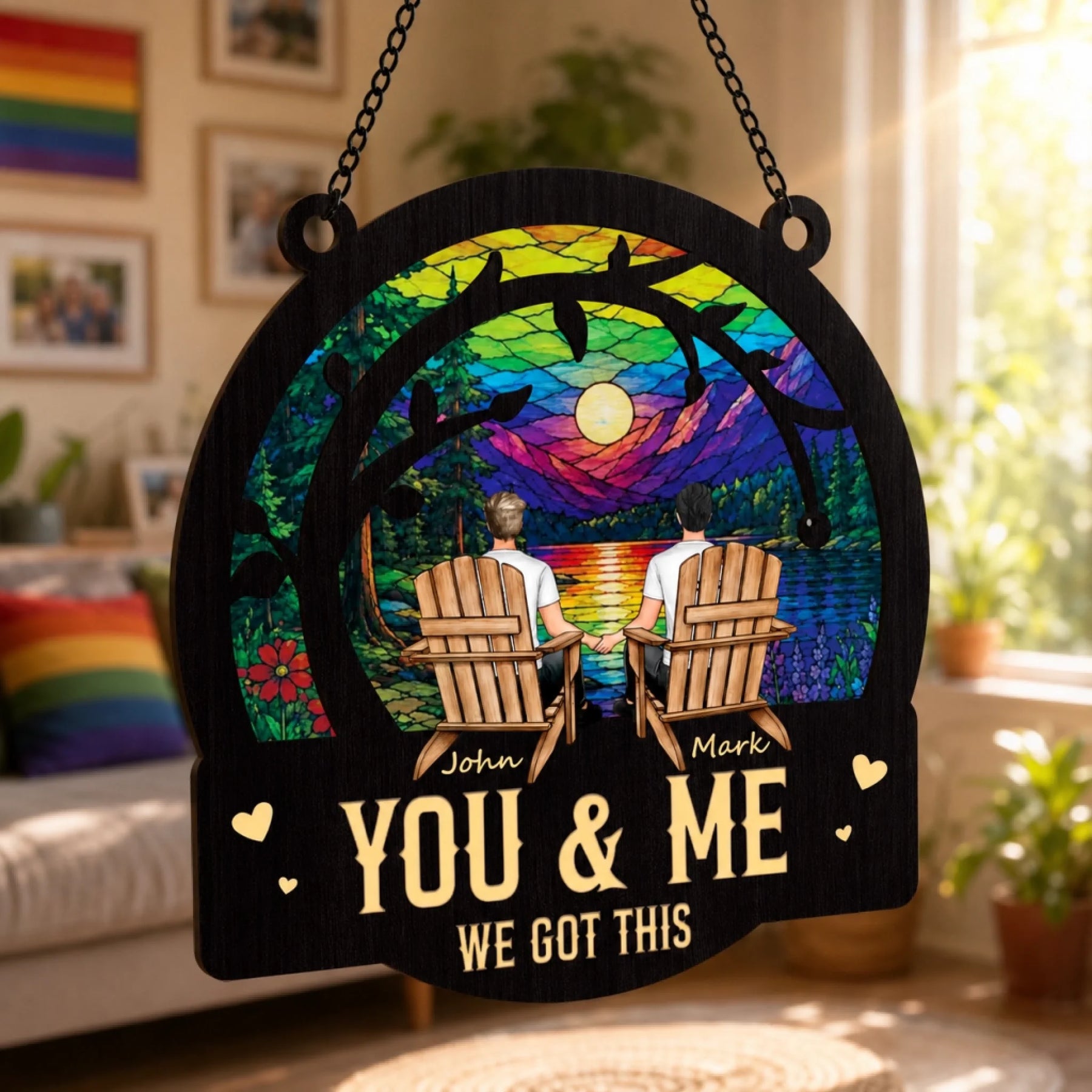 Decorative wall hanging with 'You & Me, We Got This' text in a colorful design, placed in a room with decor elements.