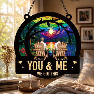 Decorative sign with 'You & Me, We Got This' text, sitting in a cozy room.