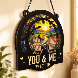 Decorative wall hanging with 'You & Me We Got This' text and a couple in Adirondack chairs.