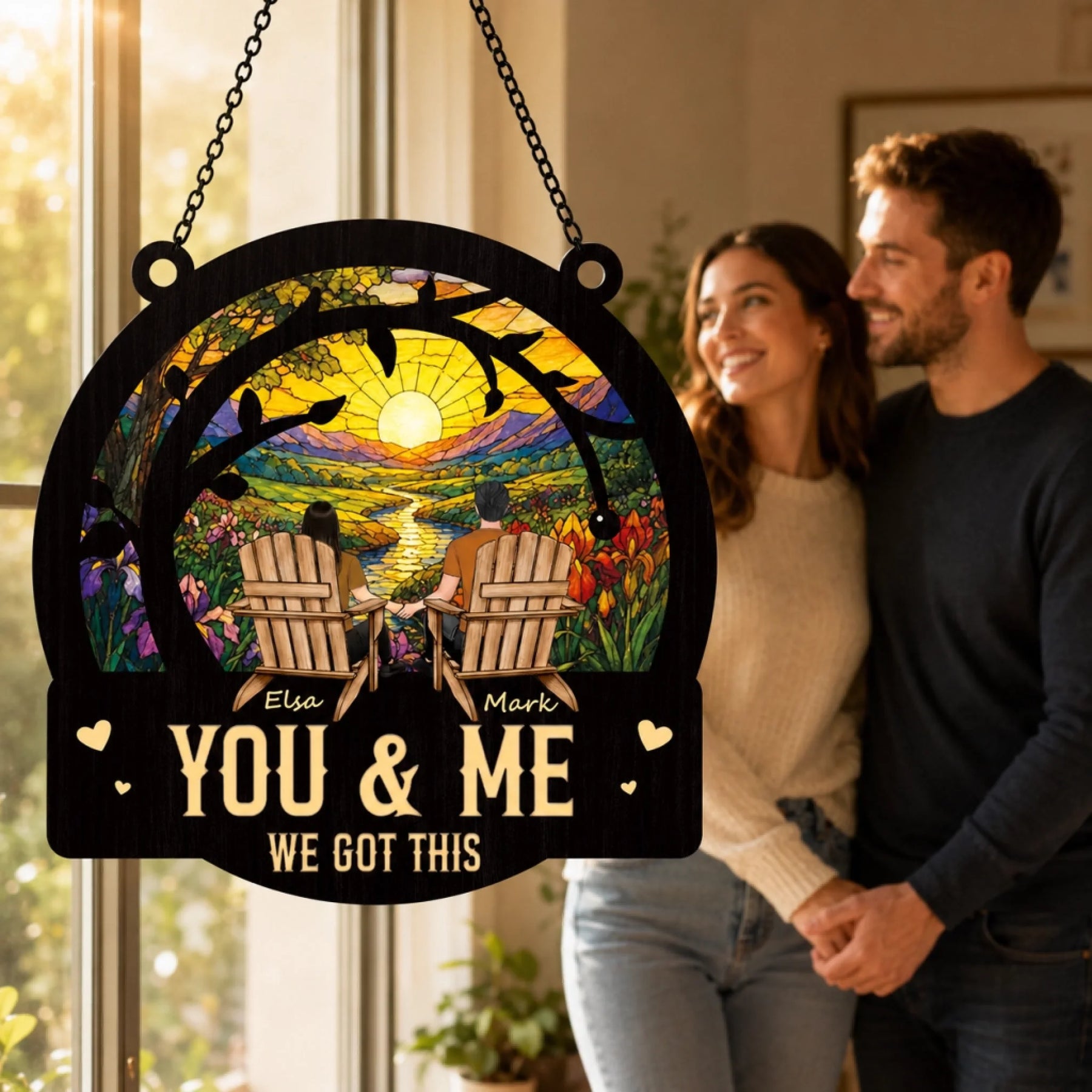Decorative sign with 'You & Me We Got This' text, couple standing behind it.