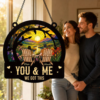 Decorative sign with 'You & Me We Got This' text, couple standing behind it.
