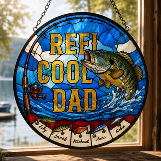 Stained glass window with 'Reel Cool Dad' text and fish illustration, hanging outdoors.