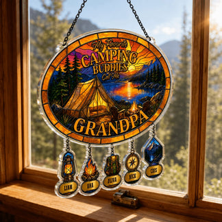 Decorative sign with camping theme and names hanging on a window