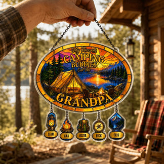 Decorative sign with camping theme and names in front of a cabin