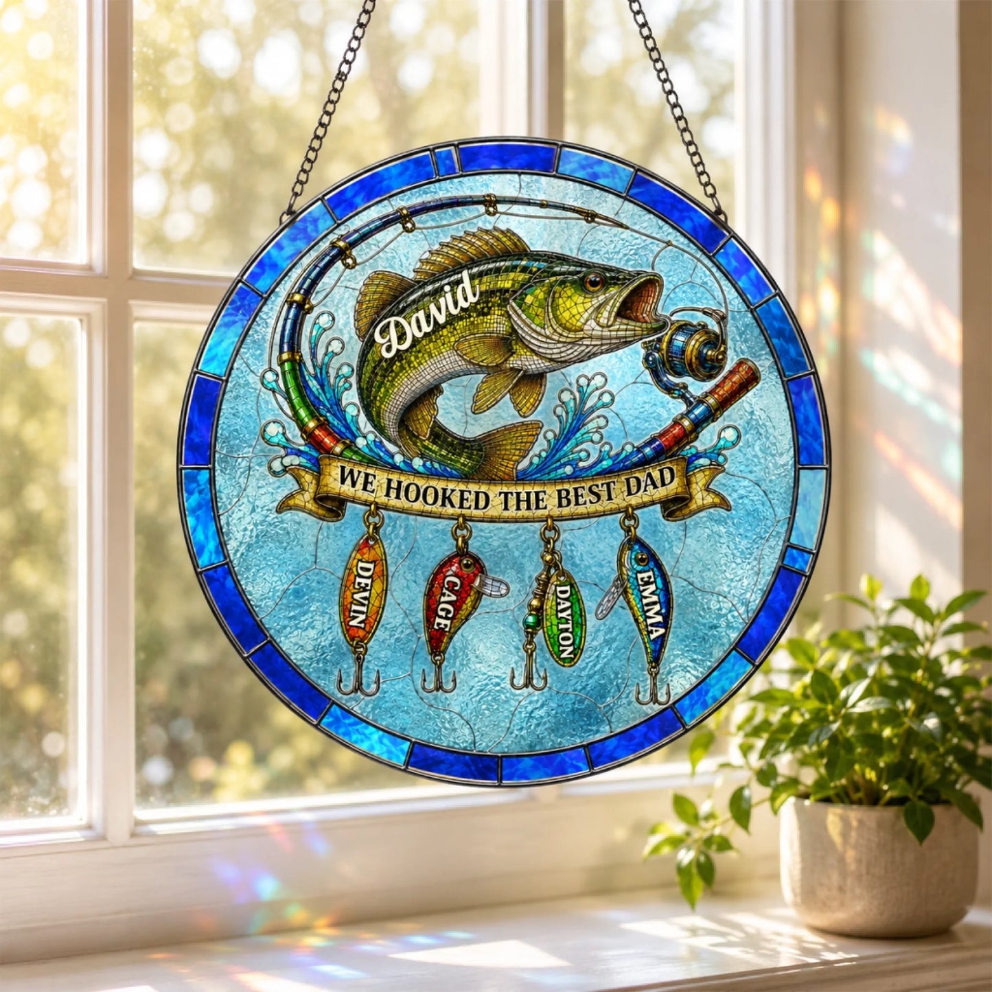 Stained glass panel with fish and fishing lures on a window sill