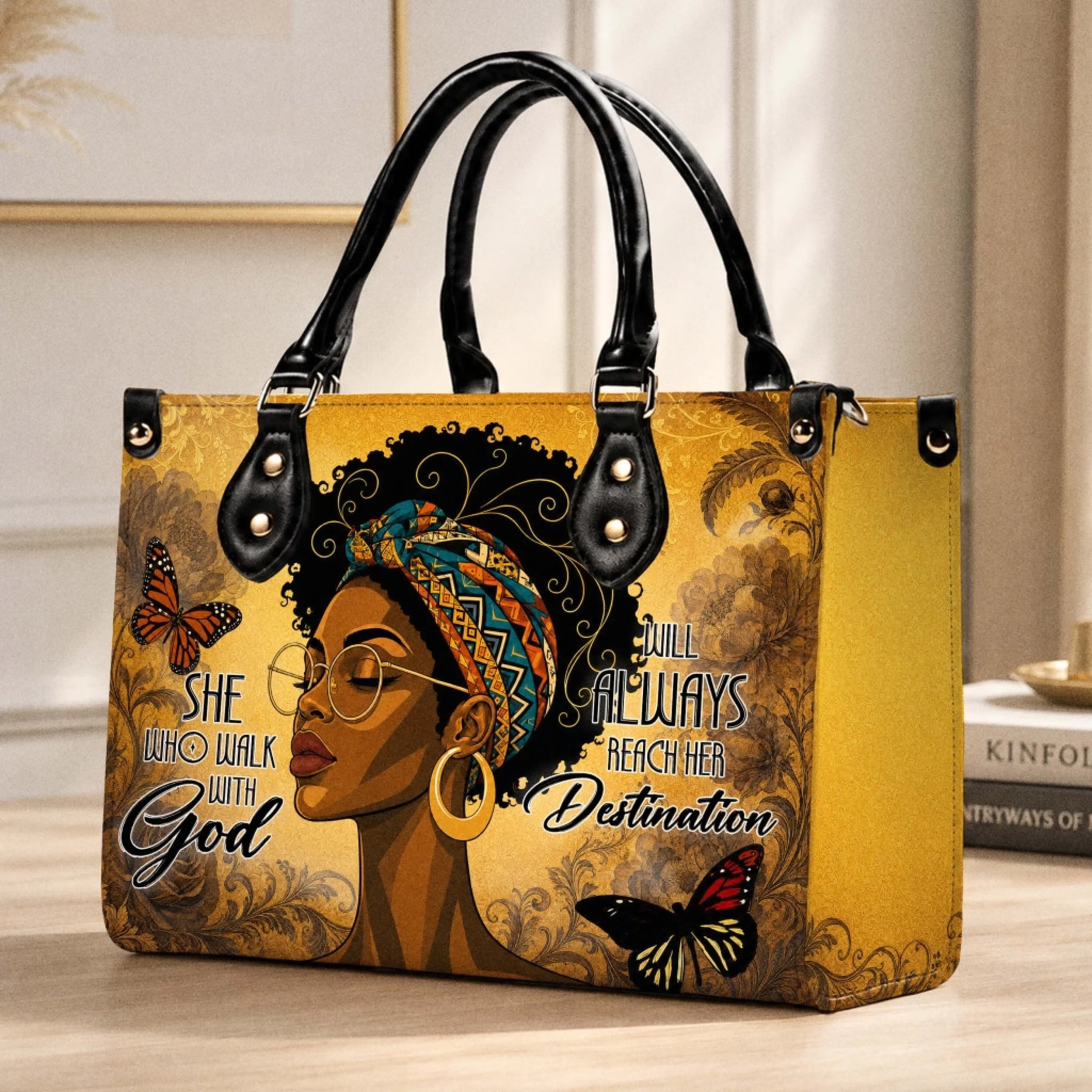 A stylish handbag featuring an artistic illustration of an African American woman with butterflies and the quote She Who Walk With God.