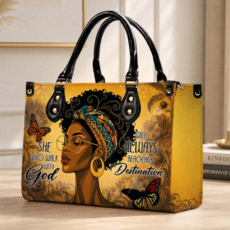 A stylish handbag featuring an artistic illustration of an African American woman with butterflies and the quote She Who Walk With God.