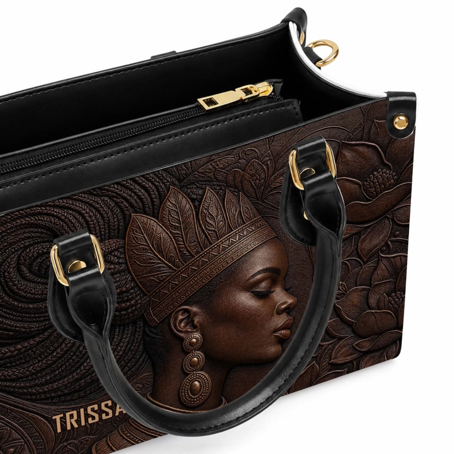 Top view of a luxury brown embossed leather handbag featuring an elegant portrait of an African American woman.
