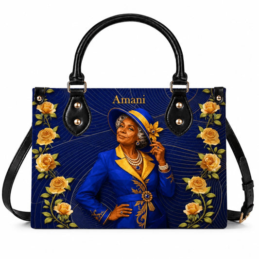 Elegant custom handbag featuring an artistic portrait of a woman in a blue suit and yellow roses with Amani text.