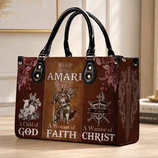 Leather handbag with Amari name customization and artistic religious illustrations including a lamb, sword, and shield.