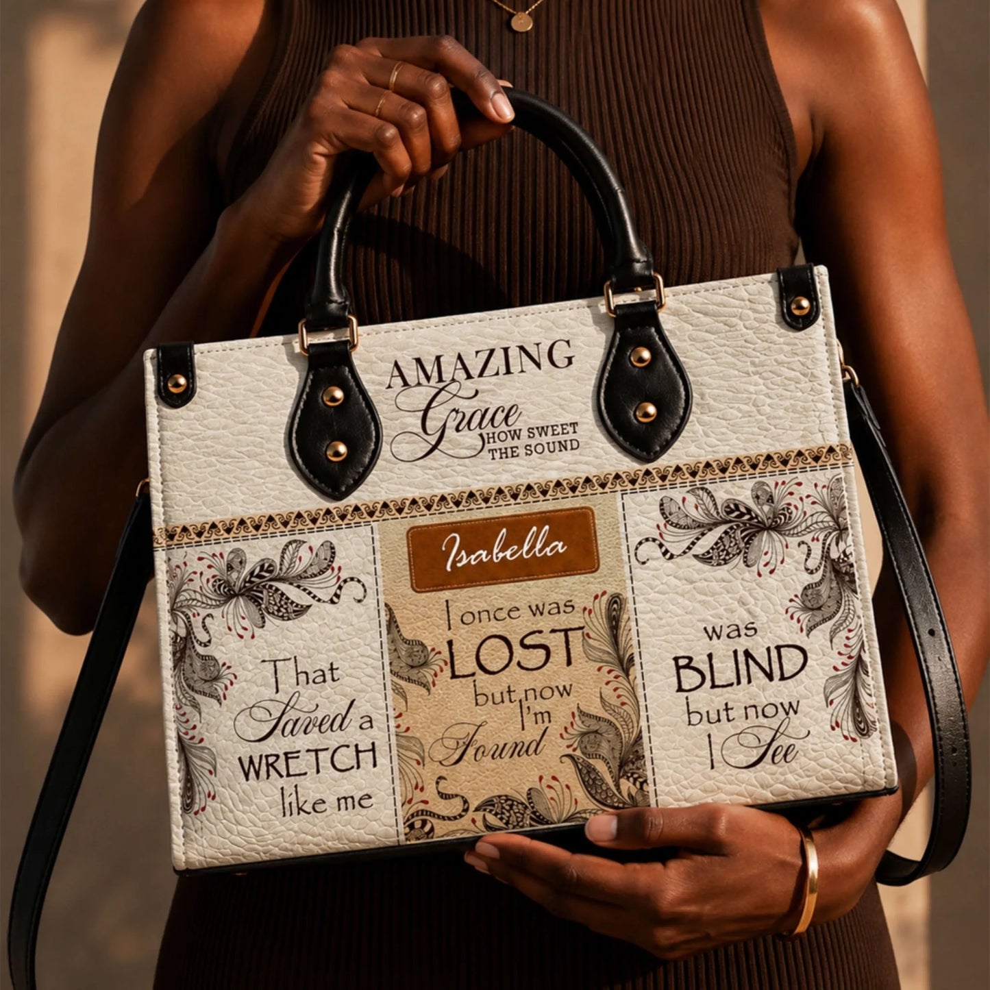 A personalized handbag featuring Amazing Grace lyrics and the name Isabella, perfect as a thoughtful spiritual gift.