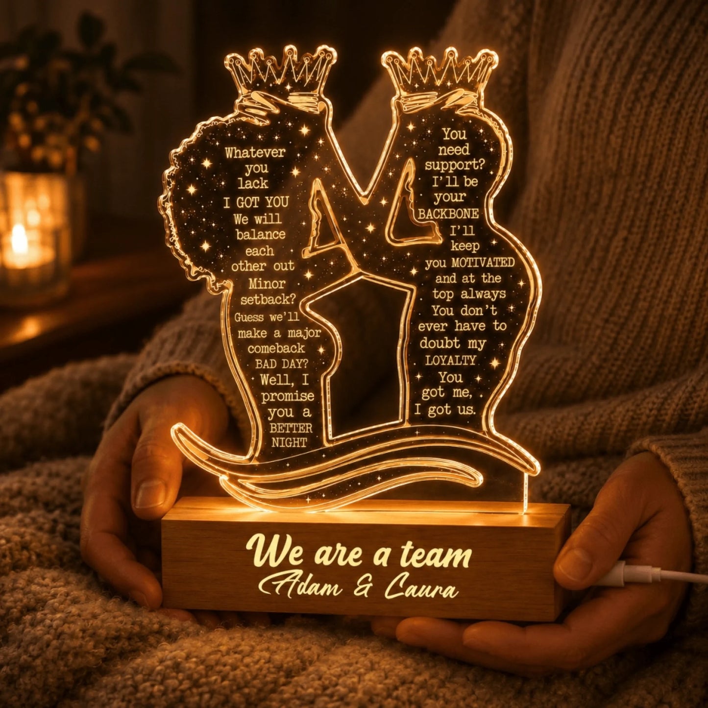 Couple holding a personalized acrylic LED night light with romantic message and names for a special anniversary gift.