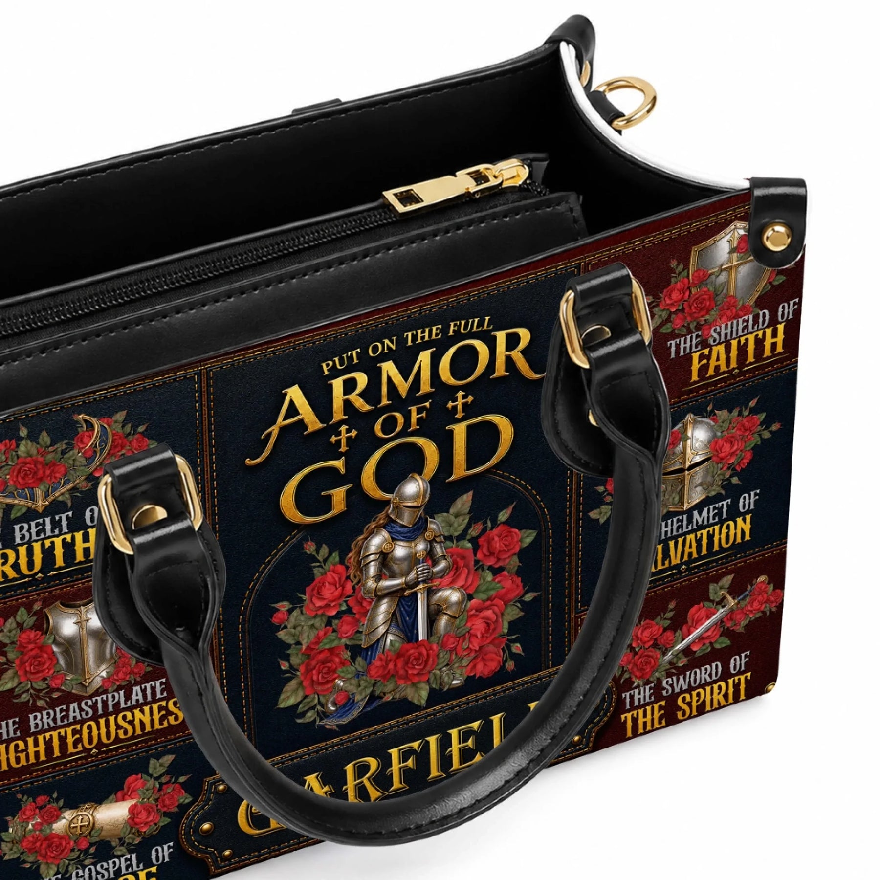 Close up of a religious Armor of God handbag showing gold hardware details and the floral knight design with Garfield.