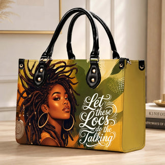 Decorative handbag placed on a desk with artwork depicting a woman with locs and the empowering phrase Let these Locs do the Talking.