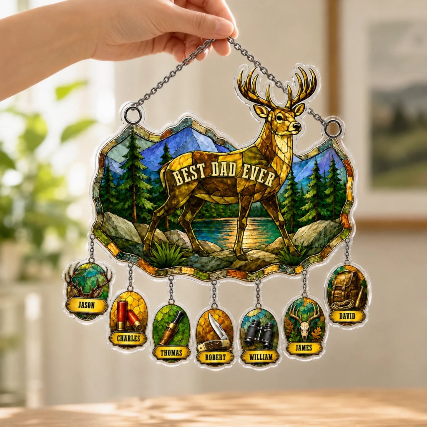 Close-up of Best Dad Ever suncatcher with personalized name charms hanging