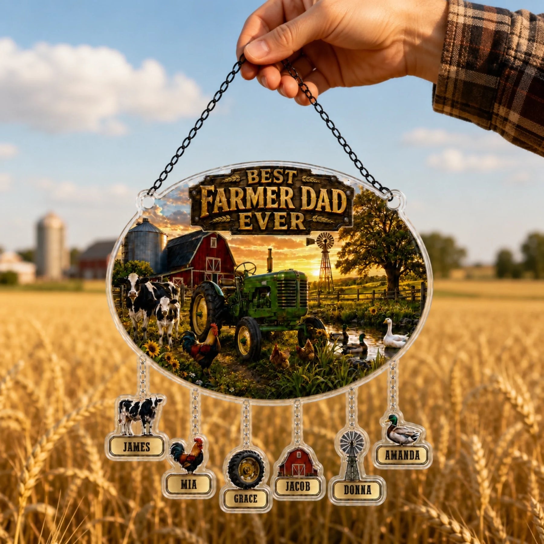 Hanging plaque with 'Best Farmer Dad Ever' text and farm-themed design, held over a rural landscape.