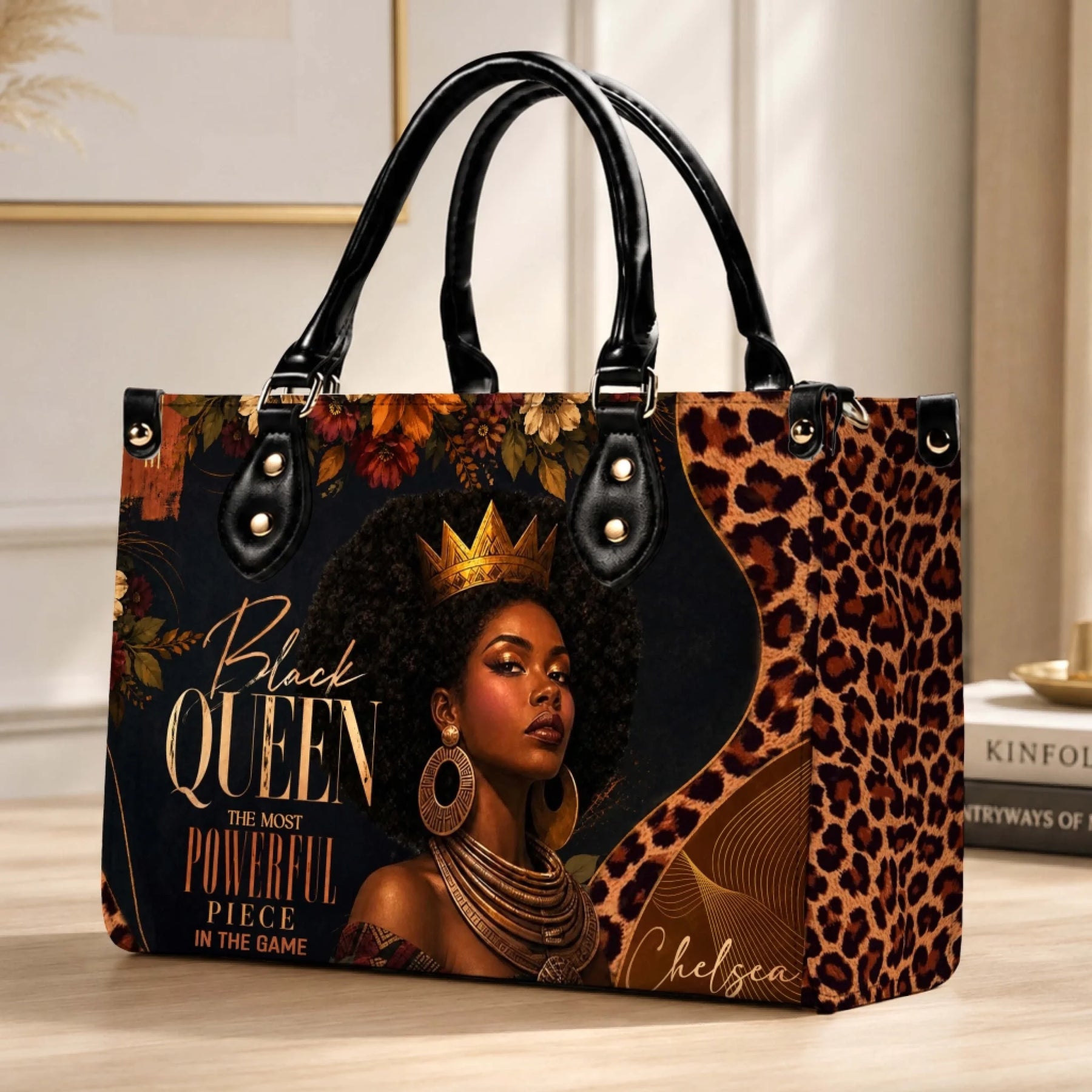 A stylish personalized handbag for women featuring a regal Black Queen portrait and elegant leopard floral details.