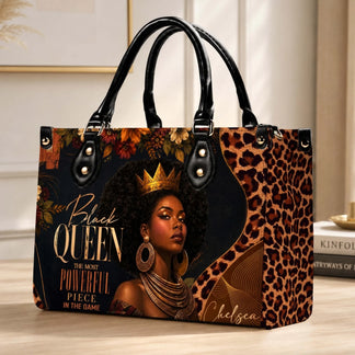 A stylish personalized handbag for women featuring a regal Black Queen portrait and elegant leopard floral details.