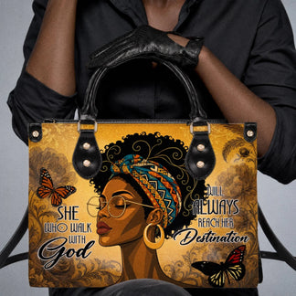 A fashionable shoulder bag displayed with a black shirt featuring an uplifting religious quote about faith and destination.