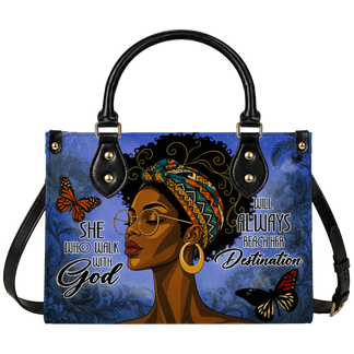 A stylish handbag featuring an artistic illustration of a black woman, butterflies, and the inspirational quote She Who Walk With God Will Always Reach Her Destination.