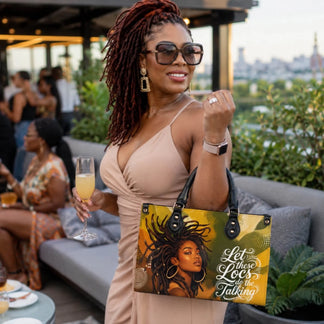 A woman holding a personalized PU leather handbag with an African American locs hair design while enjoying a celebration.