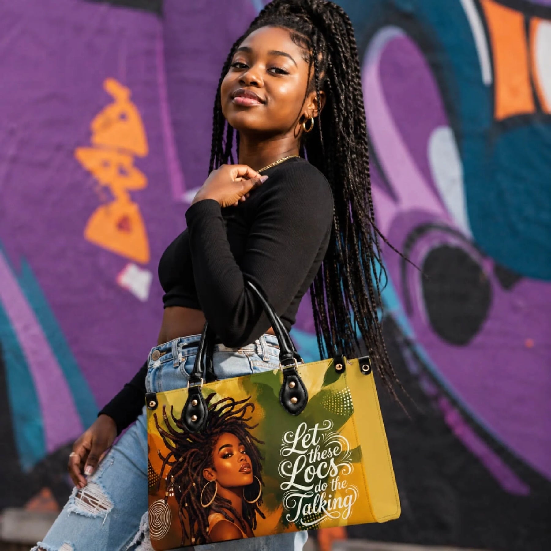 A stylish handbag featuring a portrait of a Black woman with locs and the quote Let these Locs do the Talking for a gift.