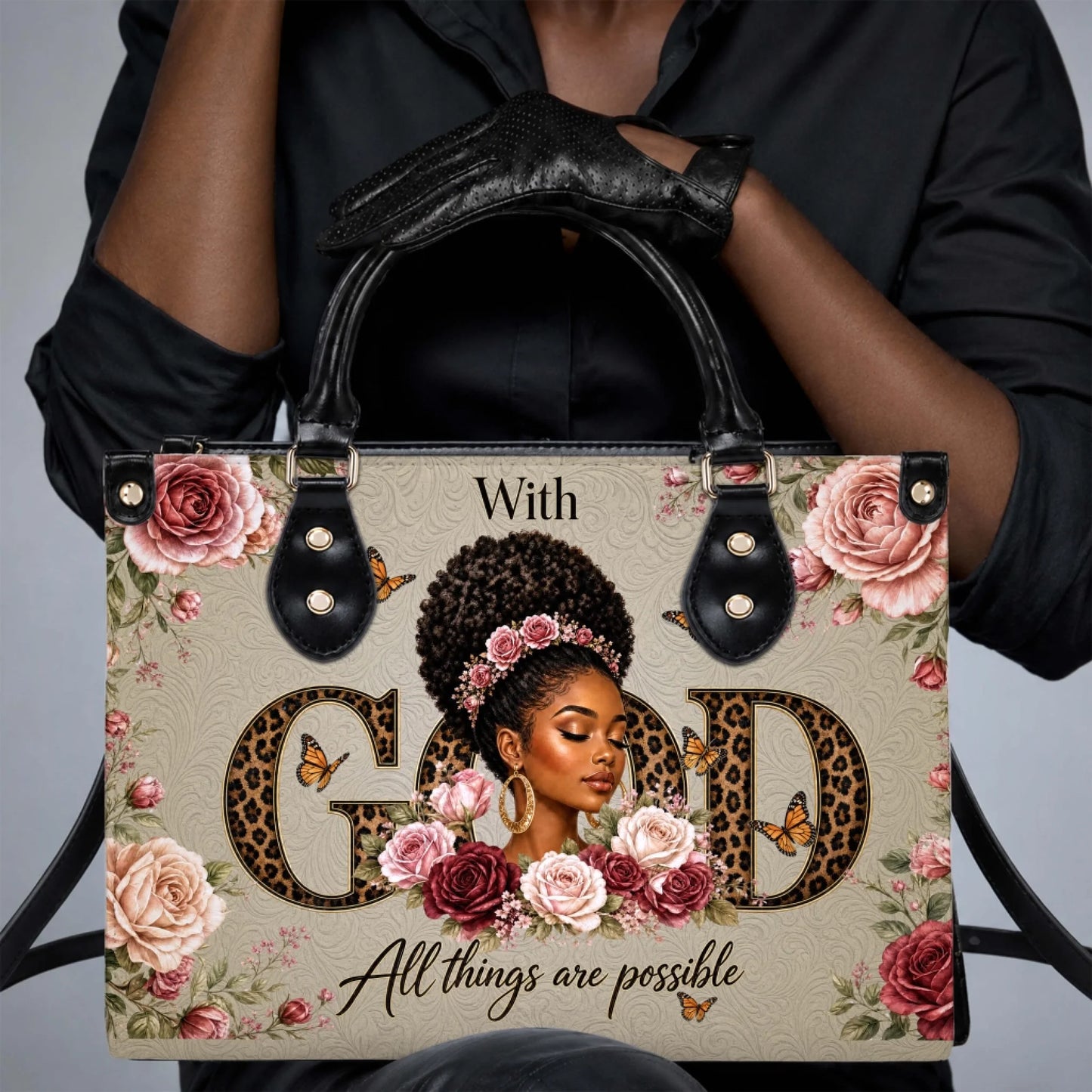 Elegant handbag with a black woman graphic, red and pink roses, butterflies, and the inspirational text With God.