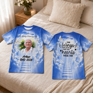 Personalized funeral t-shirt in blue featuring a custom photo of Arthur, memorial dates, and clouds with stairway design.