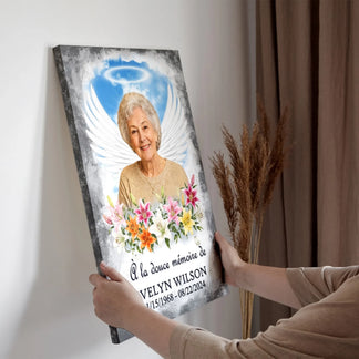 Cadre décoratif personnalisé avec photo, ailes d'ange et inscription en mémoire d'un proche décédé.