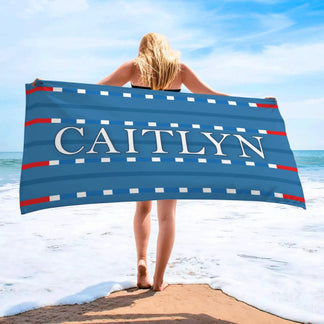 Personalized swim lane beach towel featuring the name Caitlyn, designed for swimmers and beach day enthusiasts.