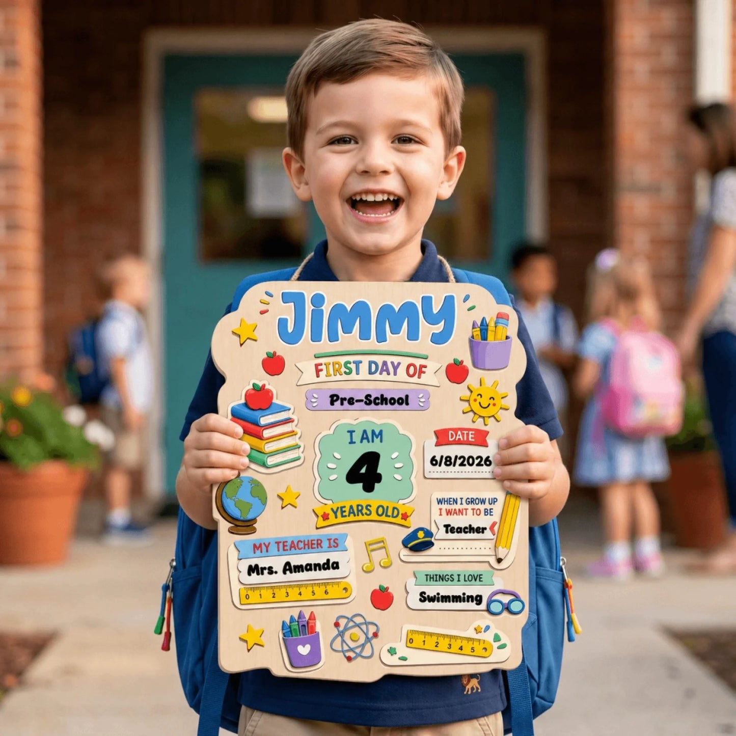 Happy child holding a personalized wooden first day of preschool sign for Jimmy with school supplies and custom details.
