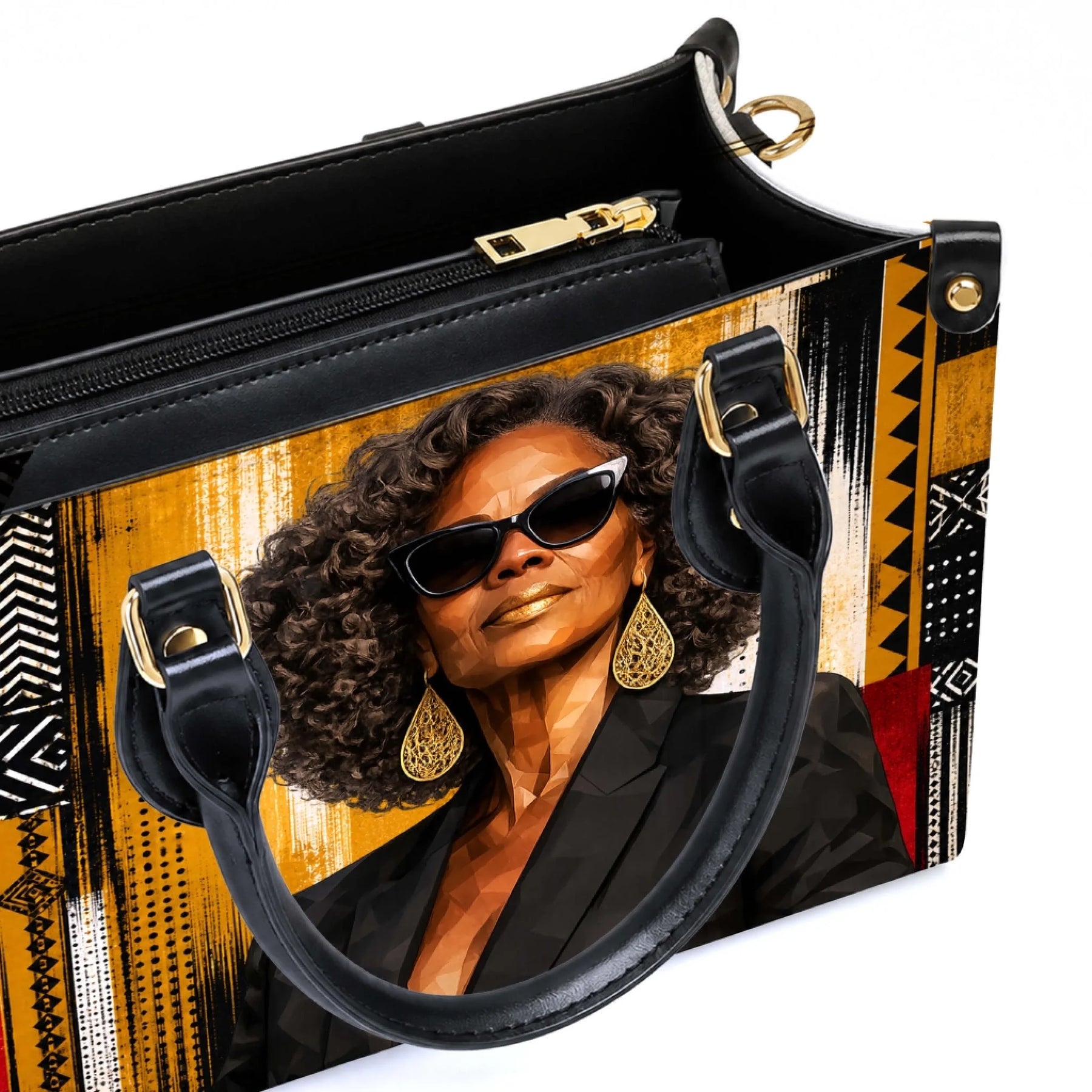 Close up of a premium handbag featuring a detailed portrait print of a fashionable woman with afro hair and gold jewelry.