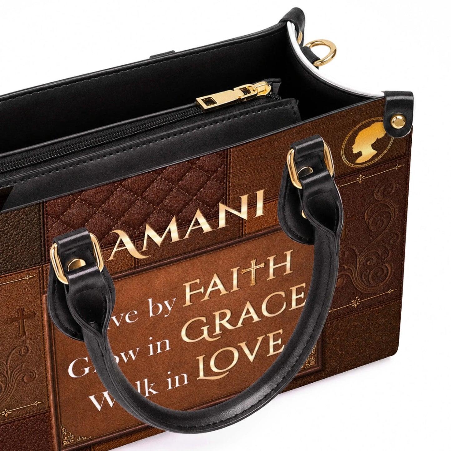 Close up of a personalized brown handbag displaying a gold female silhouette icon and the religious message Live by Faith.