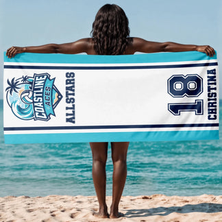 Custom Coastline Aces Allstars beach towel held by a person at the beach with personalized name and player number 18.