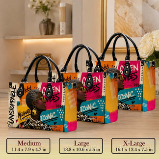 Three sizes of a vibrant tote bag featuring a modern Black art theme displayed on a wooden surface with dimension labels.