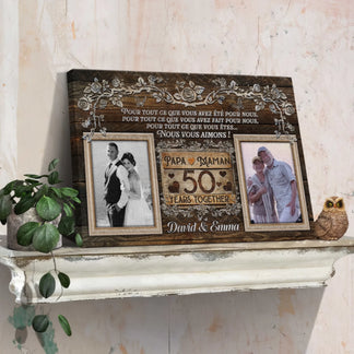 Personalized 50th anniversary wall decor with two photo frames and custom names displayed on a white shelf