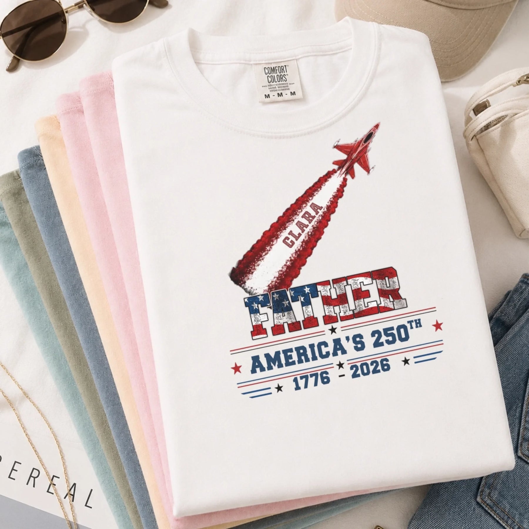 Patriotic custom America's 250th anniversary t-shirt featuring a jet plane graphic and personalized Clara name text.