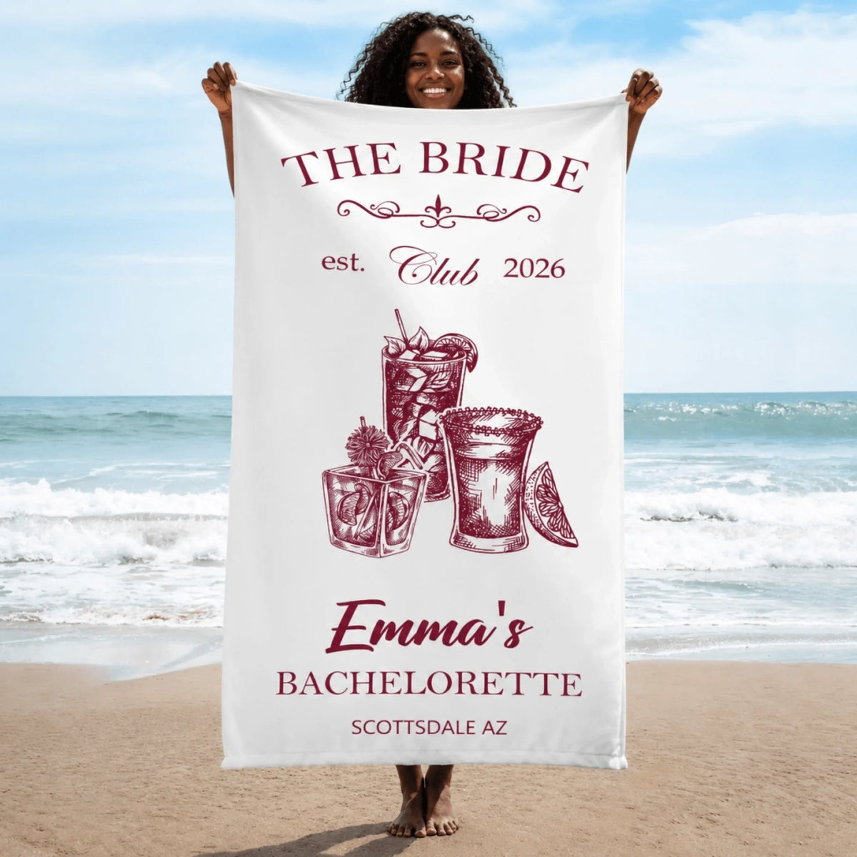 White personalized beach towel for a bachelorette party featuring cocktail graphics and custom bridal text.