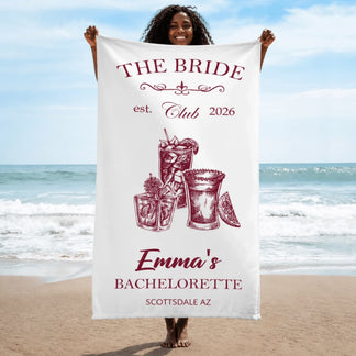 White personalized beach towel for a bachelorette party featuring cocktail graphics and custom bridal text.