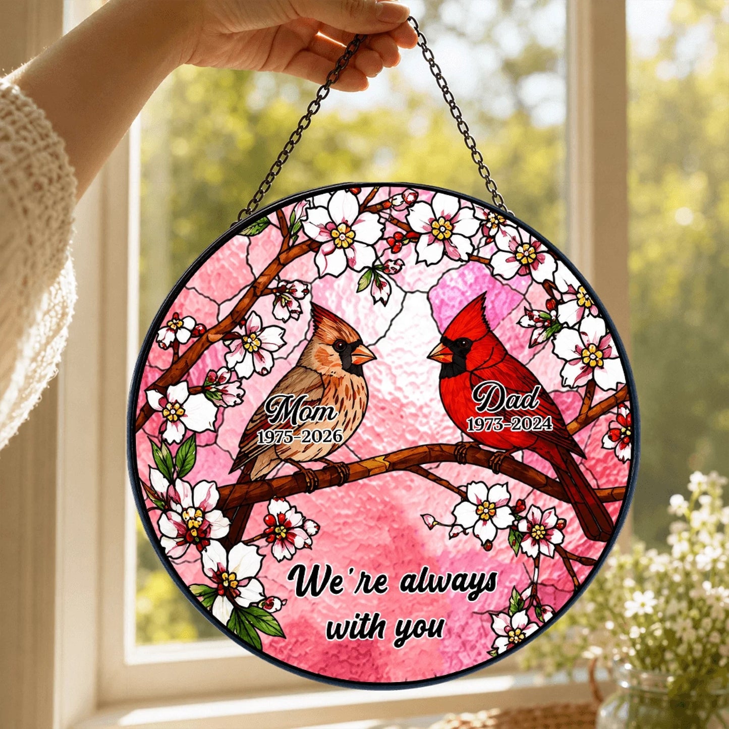 Hanging acrylic suncatcher featuring two cardinals on a cherry blossom branch with memorial text for mom and dad.