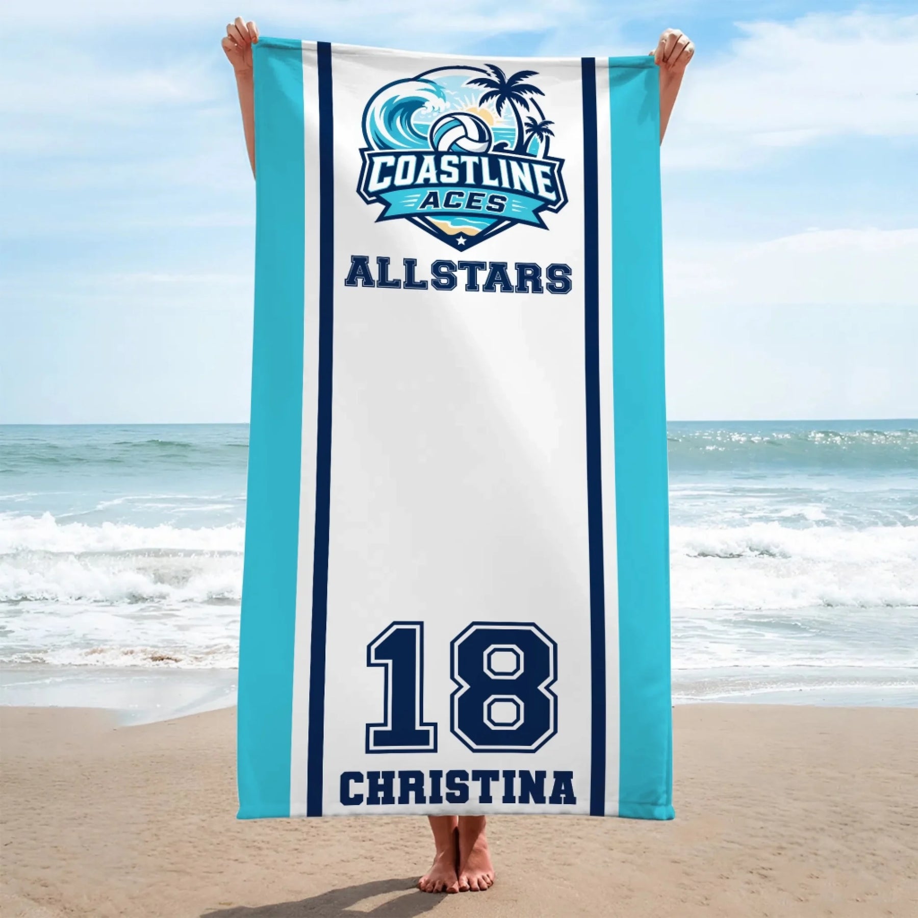 Person holding a custom Coastline Aces Allstars volleyball beach towel with name and number 18 at the beach.