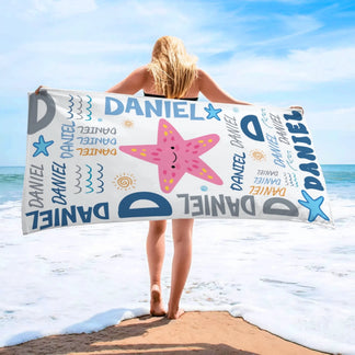 Personalized beach towel with a starfish print and Daniel text design, perfect for beach days or summer vacations.