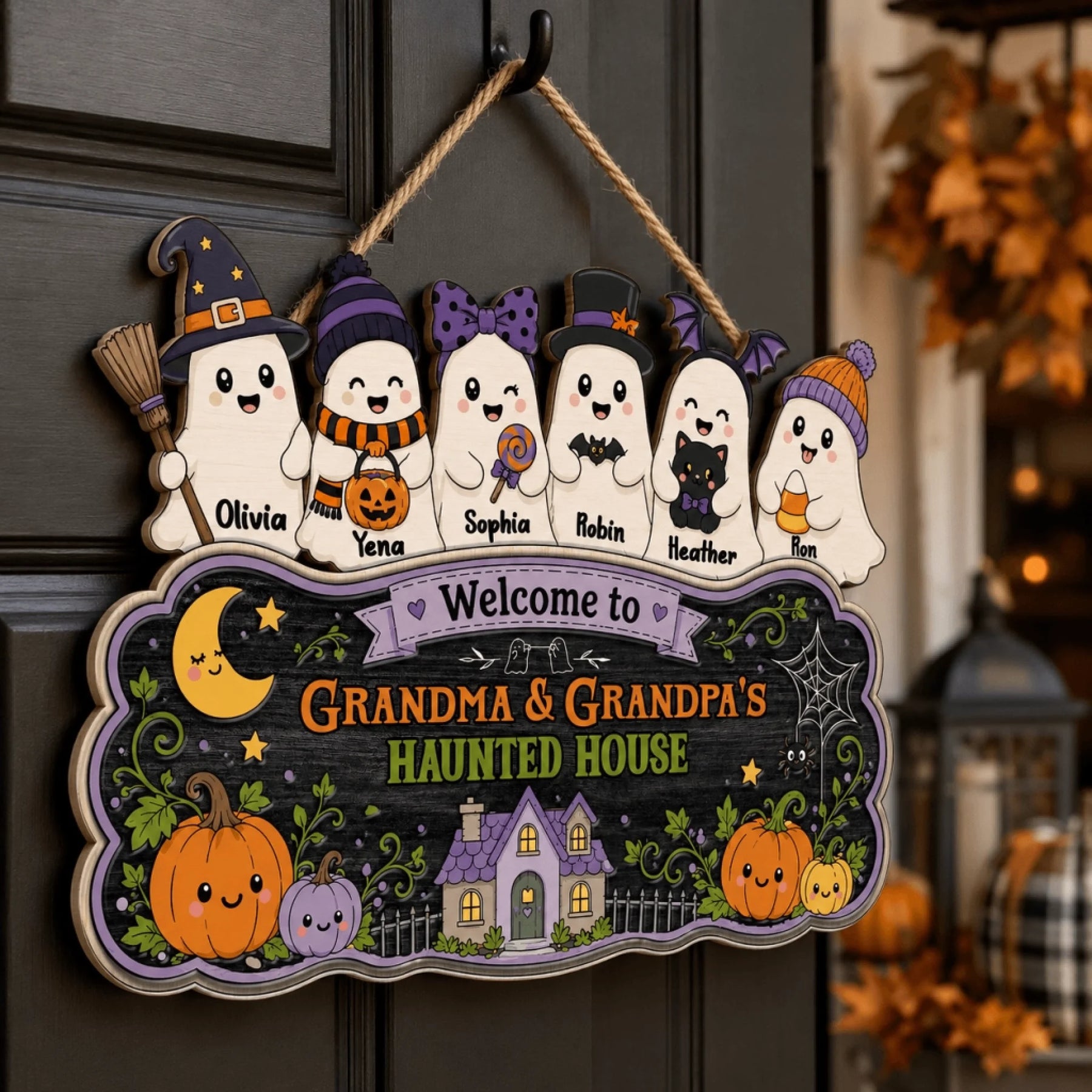 Decorative Halloween door sign featuring personalized ghost illustrations and the text Grandma and Grandpa's Haunted House.