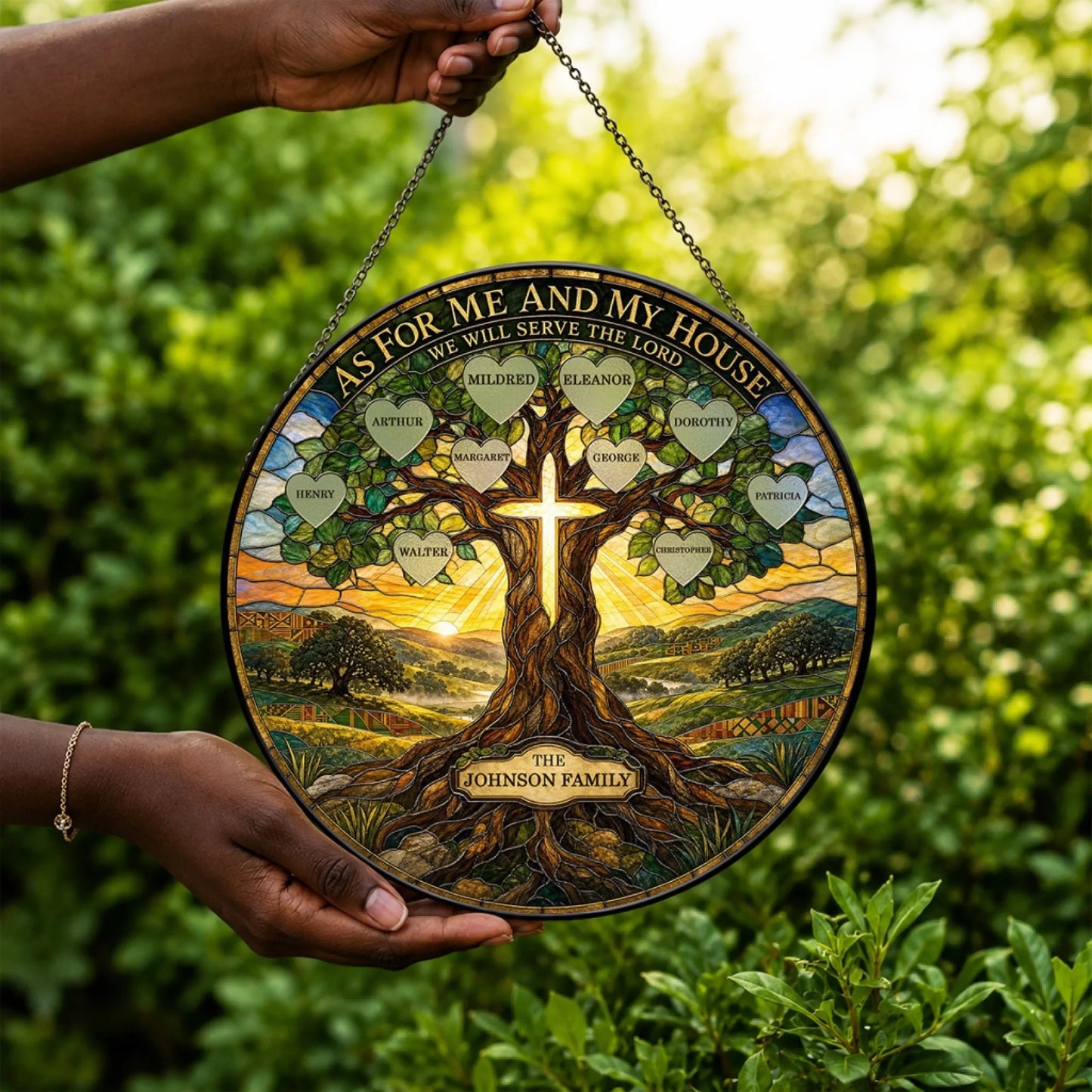 Hand holding a custom family tree stained glass ornament with names in hearts and a cross motif, perfect for religious gifting.
