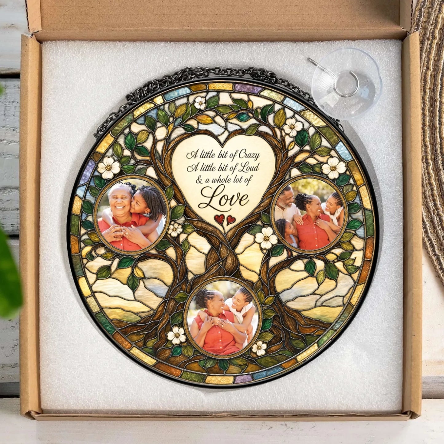Personalized family tree stained glass suncatcher keepsake gift displayed in packaging with a suction cup hanger