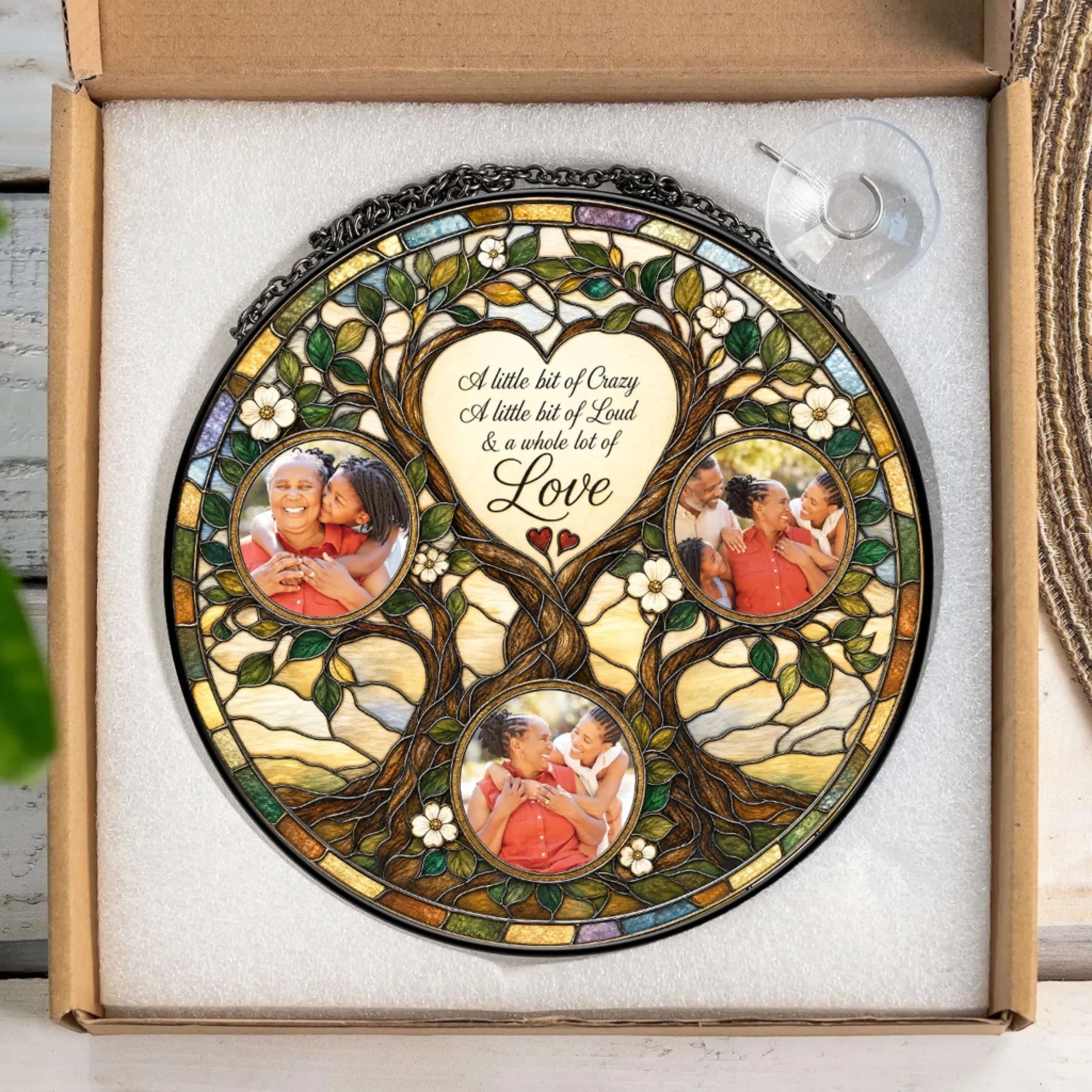 Personalized family tree stained glass suncatcher keepsake gift displayed in packaging with a suction cup hanger