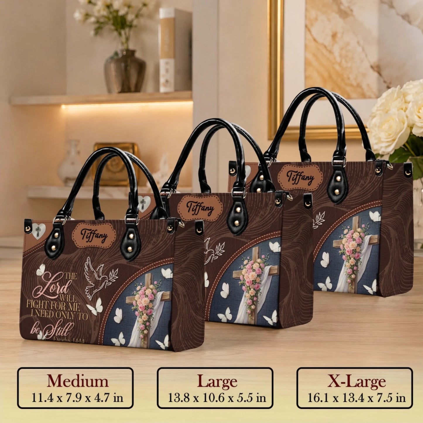 Display of three size options for religious themed personalized floral cross handbag for Christian gift occasions