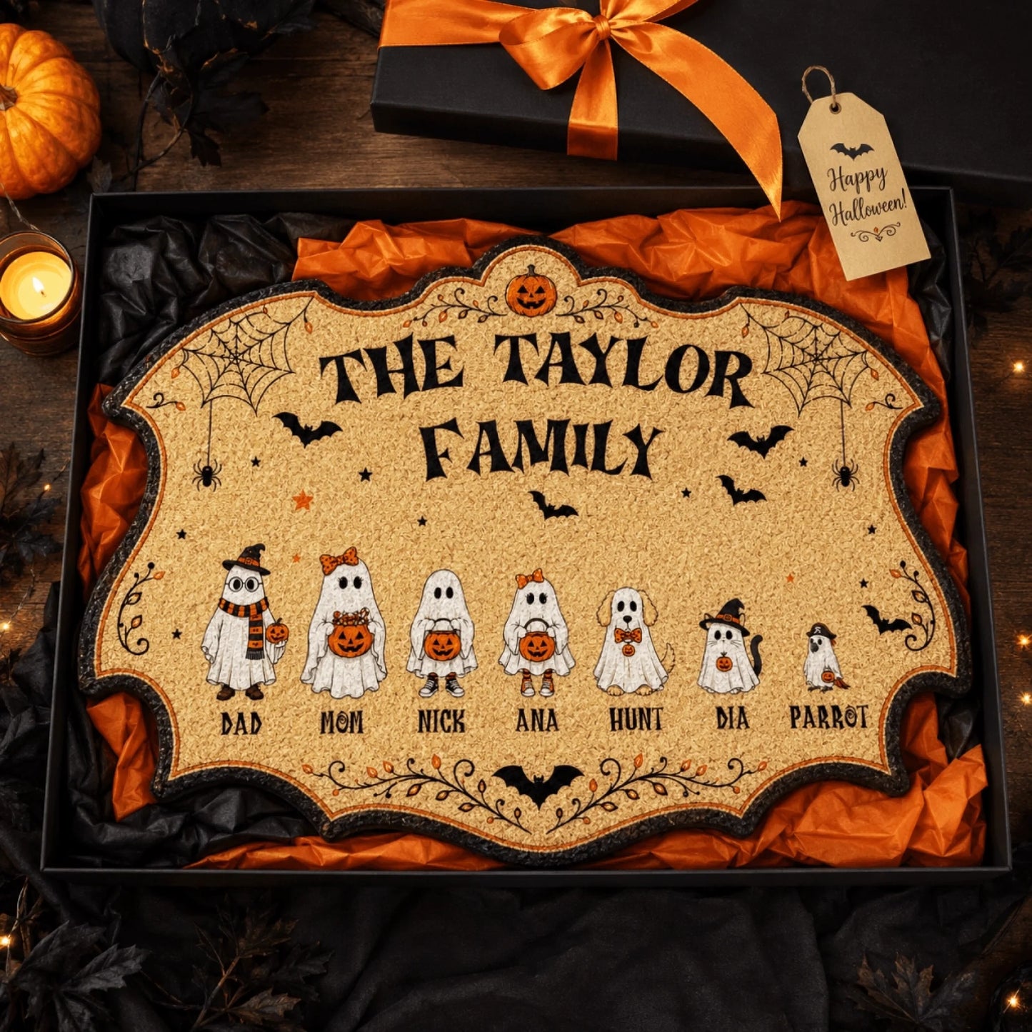 Personalized Halloween ghost family doormat gift for the Taylor family packed in a festive box with ribbon.