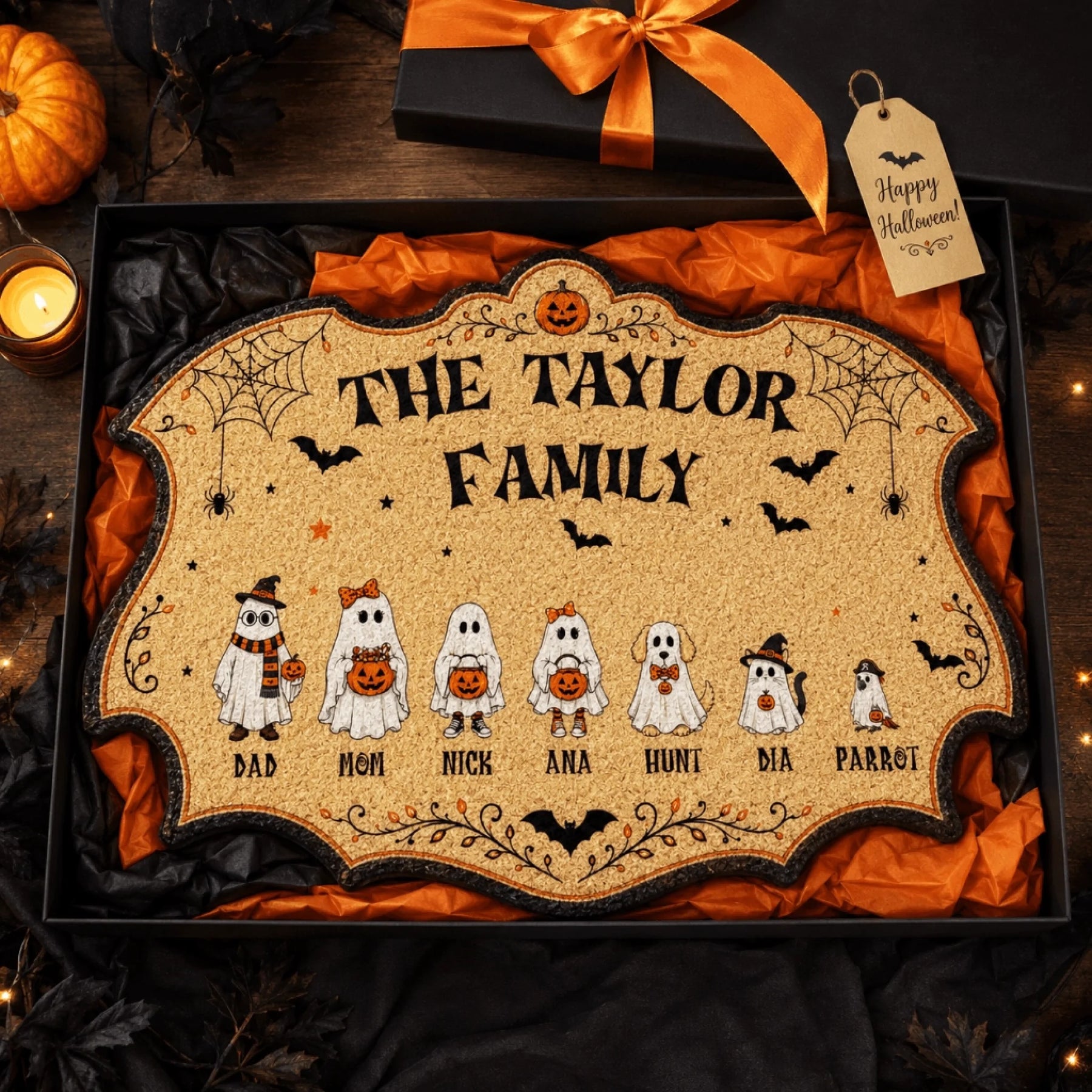 Personalized Halloween ghost family doormat gift for the Taylor family packed in a festive box with ribbon.