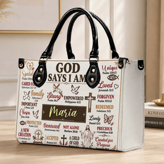 A white PU leather handbag with black handles customized with the name Maria and inspirational faith-based quotes.